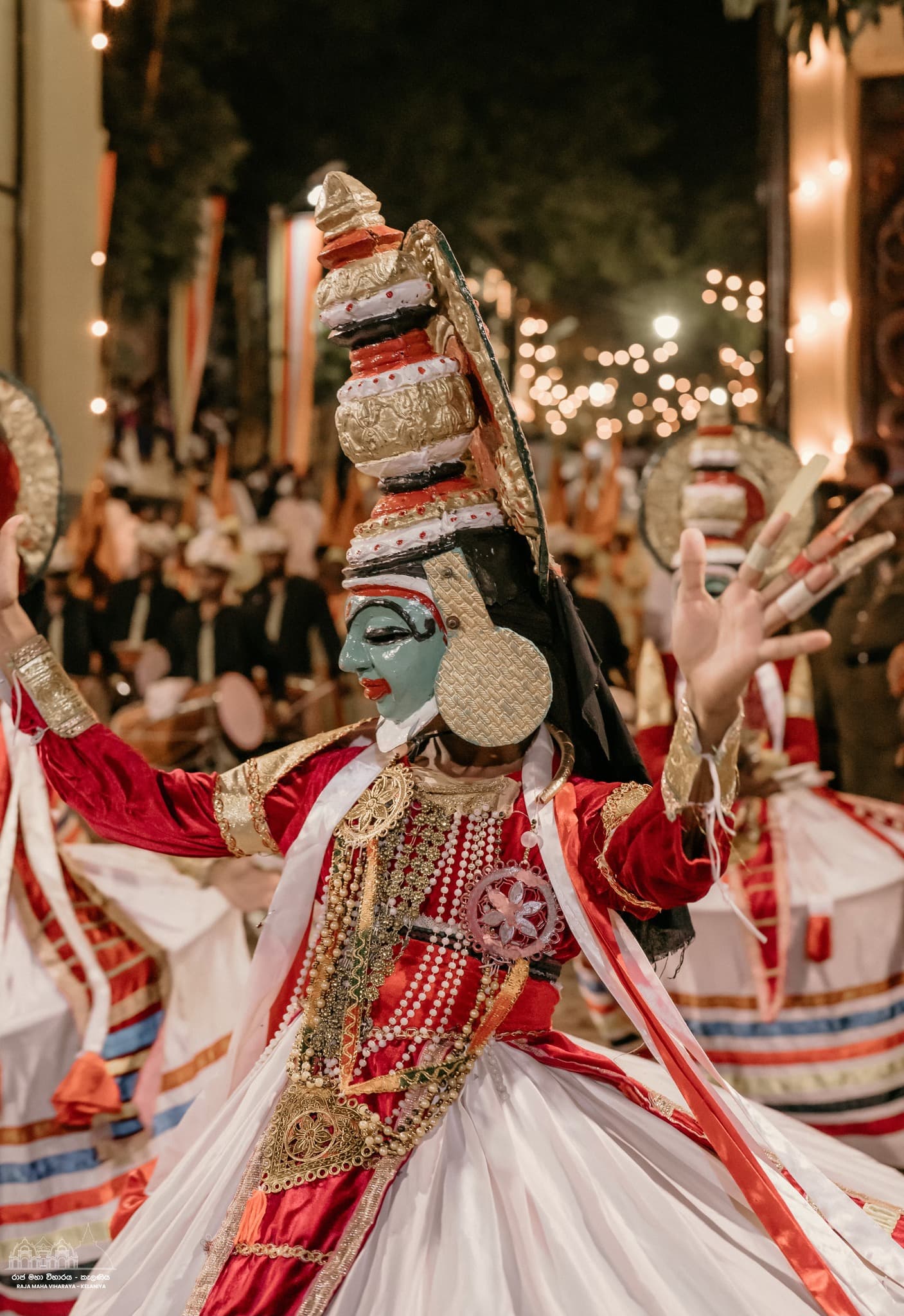 Devotees and dancers in vibrant attire
